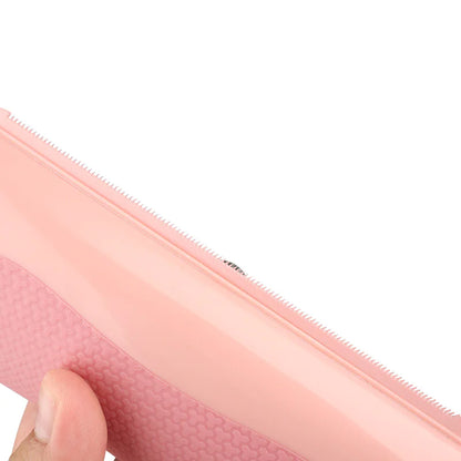 Close-up of a pink Pet Grooming Comb showcasing its dual-sided design and ergonomic grip.