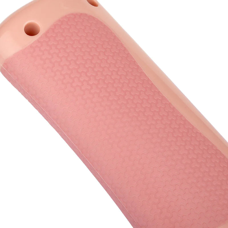 Close-up of the innovative handle of the Pet Grooming Comb, showcasing its textured grip and ergonomic design.