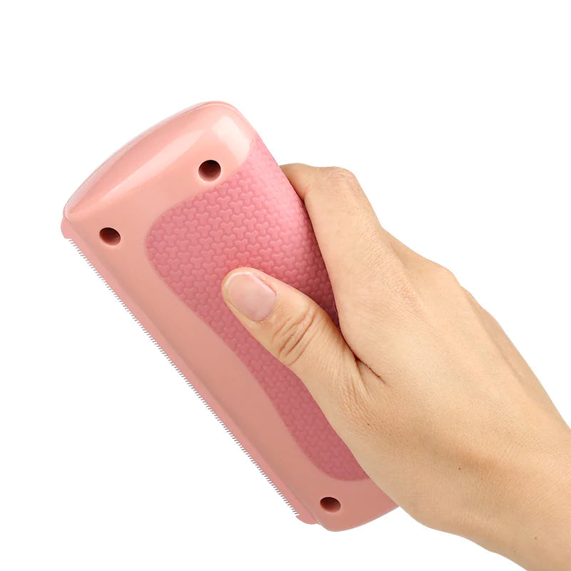 Pet Grooming Comb held in hand, showcasing its ergonomic design for easy use and effective grooming.
